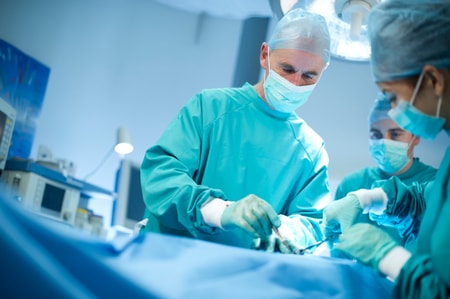 Surgeons performing a facial reconstruction operation